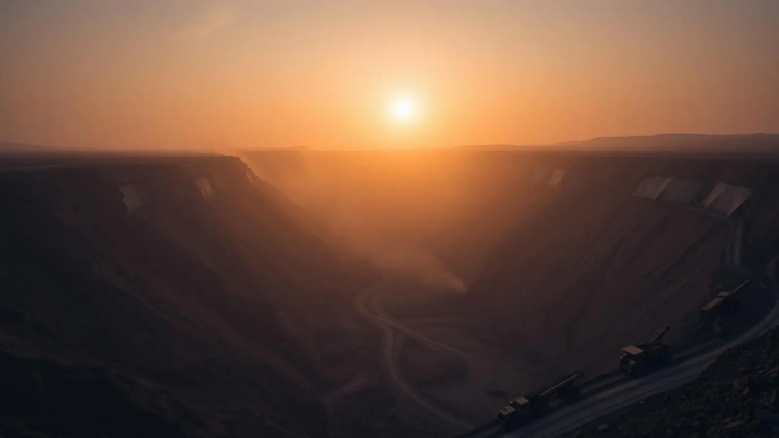 Open-pit mining operation at sunrise in Africa